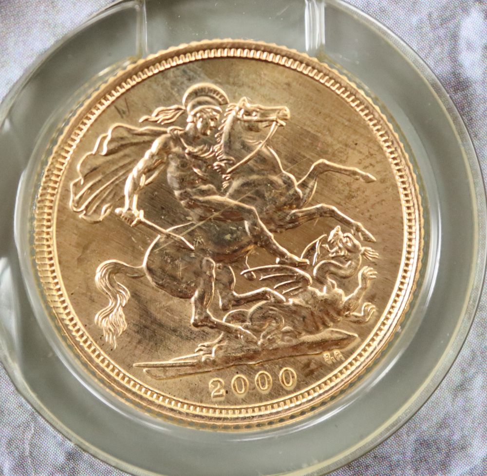 A 2000 gold sovereign, in Royal Mint packet.
